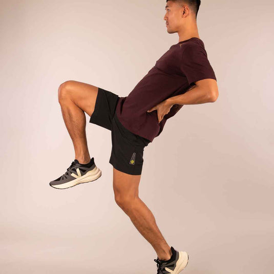 3rd Rock Short in Black - worn by male model doing goofy pose