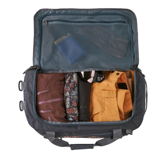 Black Hole Duffel 40L showing internal pockets with various patagonia items and ski gear within
