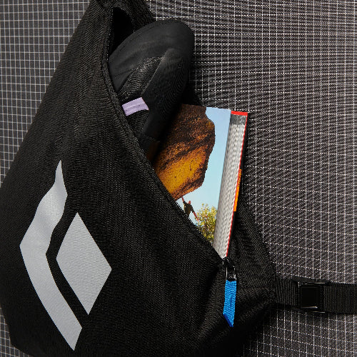 Black Diamond Piggyback Carry System - close up of zip pocket with climbing shoes and guidebook within