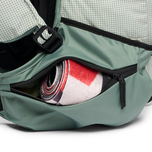 Black Diamond Dawn Patrol 25 Backpack in foam green showing zippere hip belt pockets