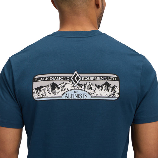 Men's Heritage Alpinist Short Sleeve Tee in Indigo - worn by model facing away - close up of mountain black diamond logo