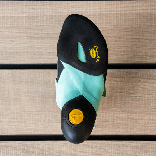 The sole of a climbing shoe, La Sportiva Skwama vegan womens, showing Vibram rubber logo