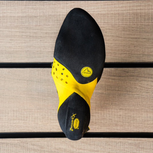 The sole of a climbing shoe, La Sportiva Solution comp, showing Vibram rubber logo