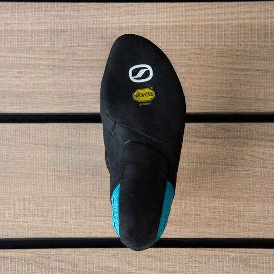 The sole of a climbing shoe, Scarpa Instinct S, showing Vibram rubber logo