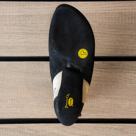 The sole of a climbing shoe, La Sportiva Katana lace women, showing Vibram rubber logo