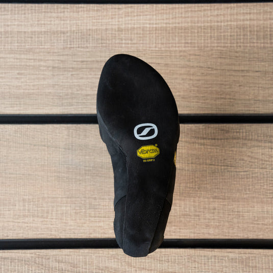 The sole of a climbing shoe, Scarpa Vapour S Women, showing Vibram rubber logo