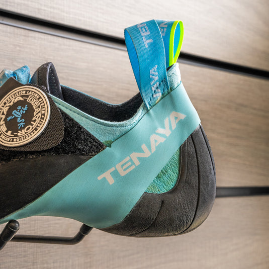 A close up of Tenaya Indalo heel, resting on black hook against metallic background.