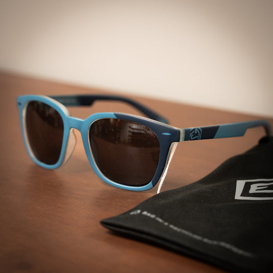 E9 claude sunglasses in Agave with black sunglasses bag in background