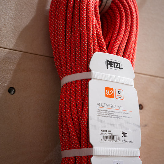 Petzl 9.2mm 60m Volta Rope in Bright orange coiled up in packaging