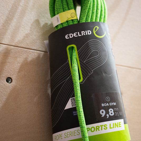 Green Edelrid BOA 9.8mm rope, coiled in black and green packaging