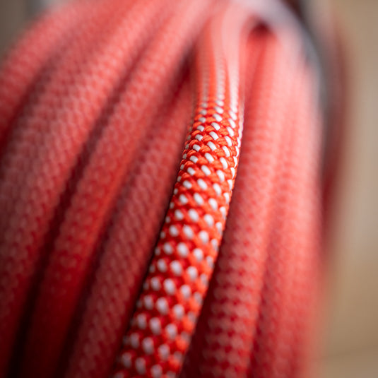 Close up of Petzl Arial climbing rope 9.5mm in reddish orange