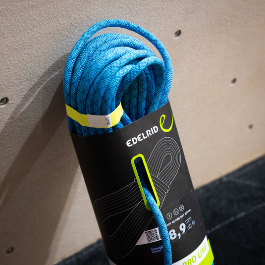 Blue Edelrid Swift 48 Pro Dry 8,9mm rope, coiled in black packaging