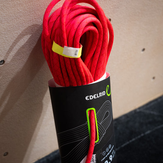 Pink Edelrid Swift 48 Pro Dry 8,9mm rope, coiled in black packaging