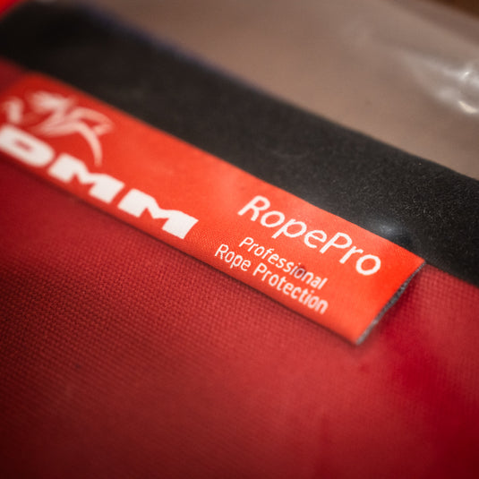 Close up of DMM RopePro Rope Protection Label in red