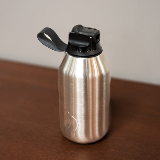 350ml stainless steel bottle displayed on wooden surface with a black flip top straw lid.