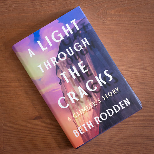 A light through the cracks - a climbers story by Beth Rodden - laid on wooden surface