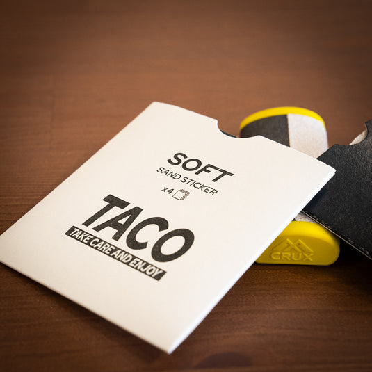 Yellow Crux Skin File laid on wooden surface with replacement soft papers in white packet