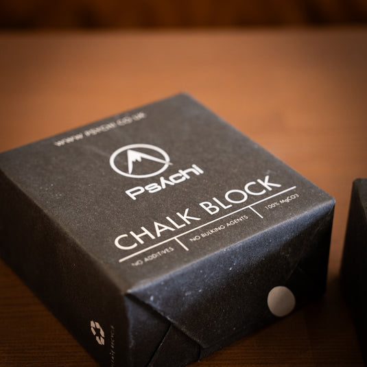 Block of Psychi Chalk in black square paper packaging.