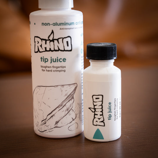 Two containers of Rhino tip juice - toughen fingertips for hard crimping, one large spray bottle and one smaller bottle with a brush on applicator.