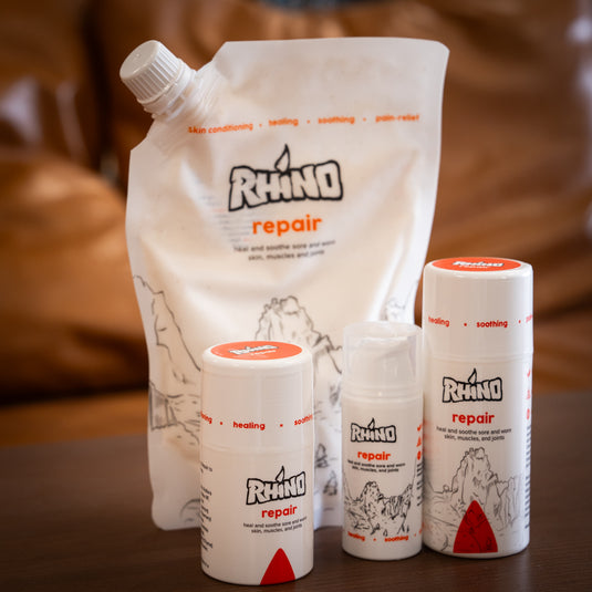 Four containers of Rhino Skin Repair - heal and soothe sore and worn skin, muscles and joints of varied sizes. One large refill pouch and three smaller bottles.