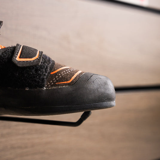 A close up of Scarpa Reflex VS toe box, resting on black hook against metallic background.