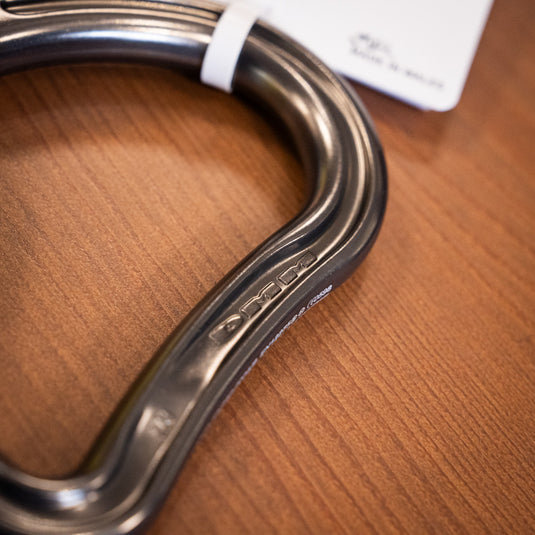 Close up of safety markings on DMM HMS CARABINER IN TITANIUM