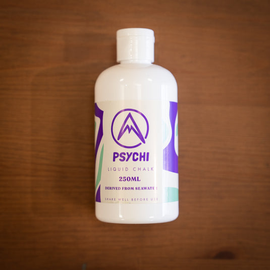 Front facing Psychi Liquid chalk, 250ml bottle with purple and green design.
