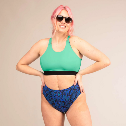 3rd Rock Equinox Sports Bra in Geo Jaguar design, worn by model with reversed teal design