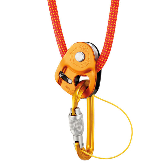 Petzl Sm'D Carabiner attached to Petzl Micro Traxion device with orange rope threaded through