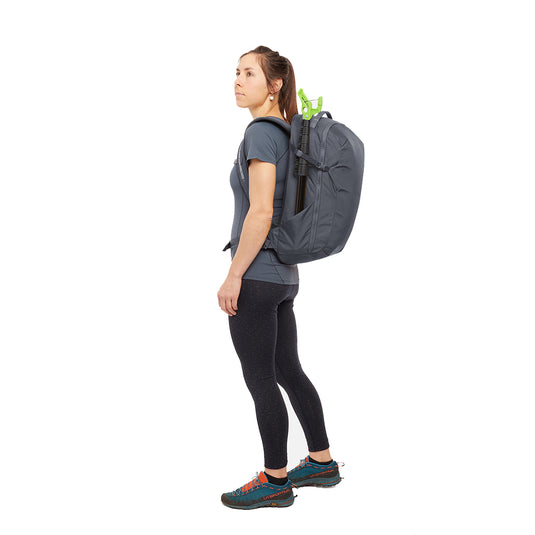 Rab Misfit 27L in Ebony on womans back beta evo ultra compact with clipstick in side pocket