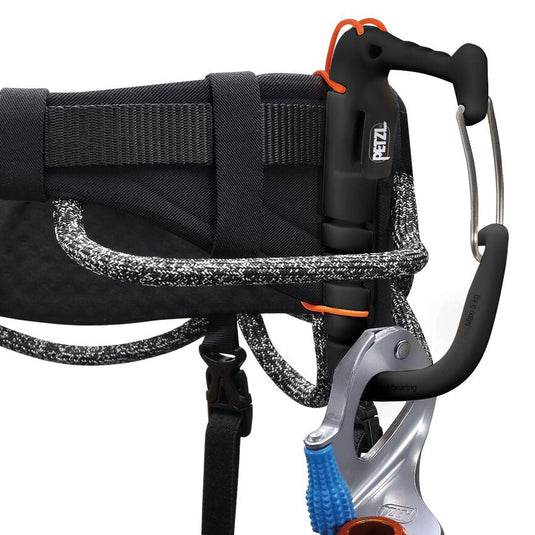 Petzl Caritool Evo in black and orange with wire gate lock in use on harness with ice screw attached