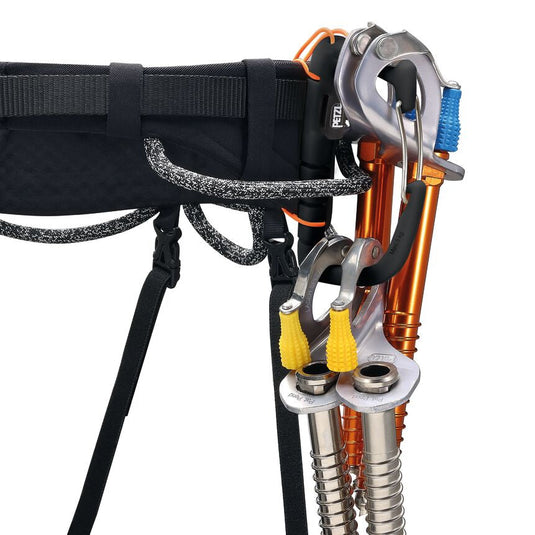 Petzl Caritool Evo in black and orange with wire gate lock in use on harness withfour ice screws attached