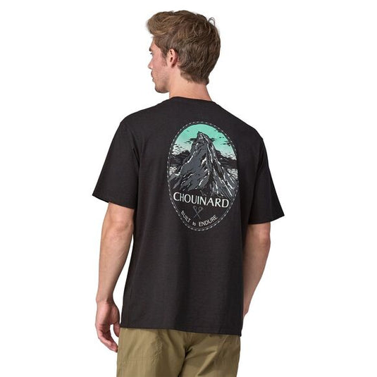Patagonia Mens Chouinard Crest Pocket Responsibili-Tee® In Black with large mountain design on back worn by model facing away