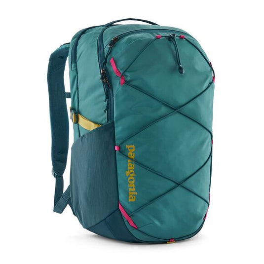 Patagonia Refugio Day Pack 30L frontal view and showing criss-cross bungee cord to store items externally in blue