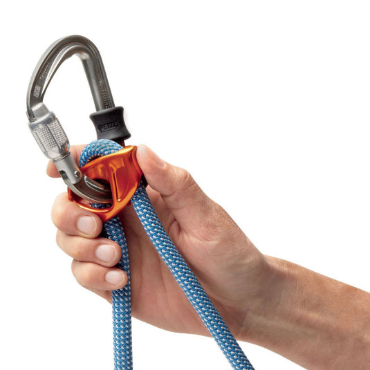 Close up image of the Petzl Connect Adjust lanyard with carabiner inserted in the connector and rubber band placed on carabiner.