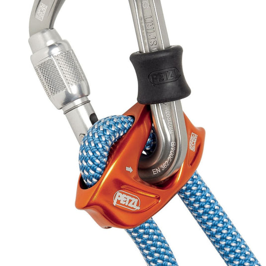 Close up image of the Petzl Connect Adjust lanyard with carabiner inserted in the connector and rubber band placed on carabiner.