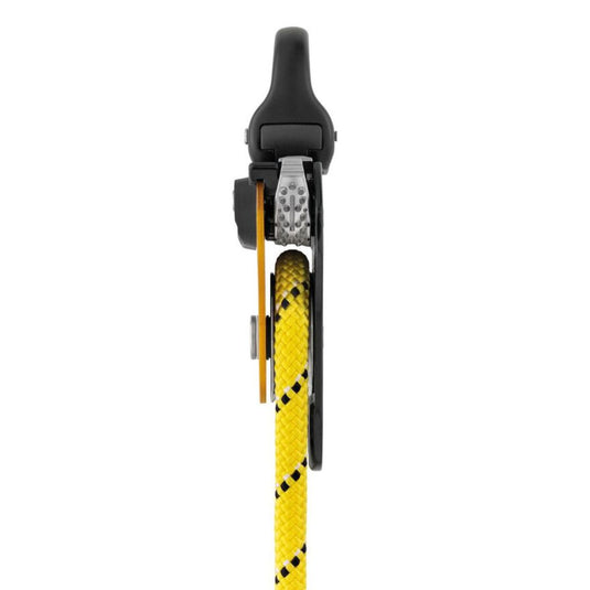 Petzl Pro Traxion: a yellow and black mechanical pulley with yellow rope in situ