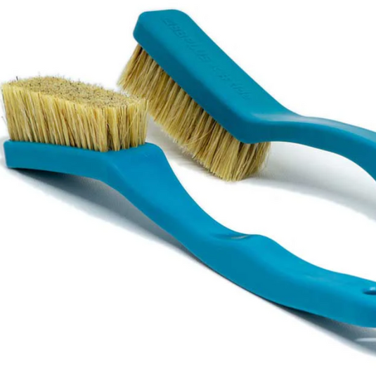 Two blue 8b+ plastic chalk brushes on white surface showcasing bristles