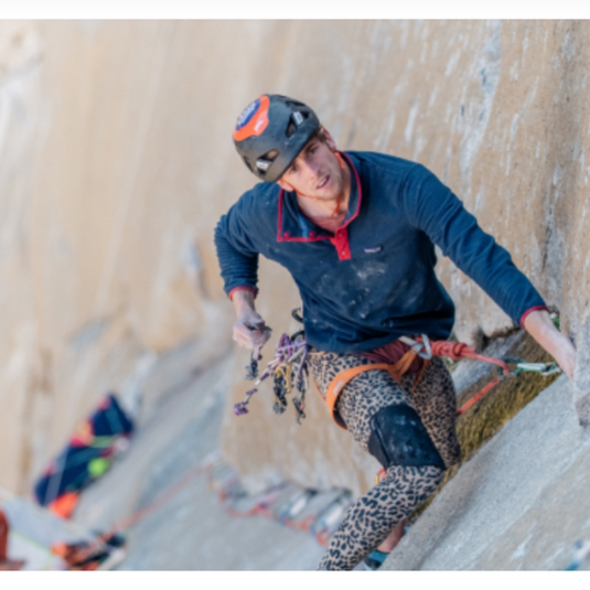 Blakpad VS kneepad worn by athlete climbing dawn wall in leopard print leggings