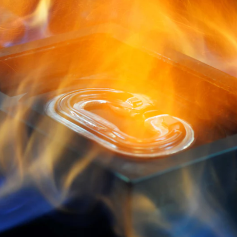 Dmm Ultra O Carabiner in Titanium surrounded by flames within a forge