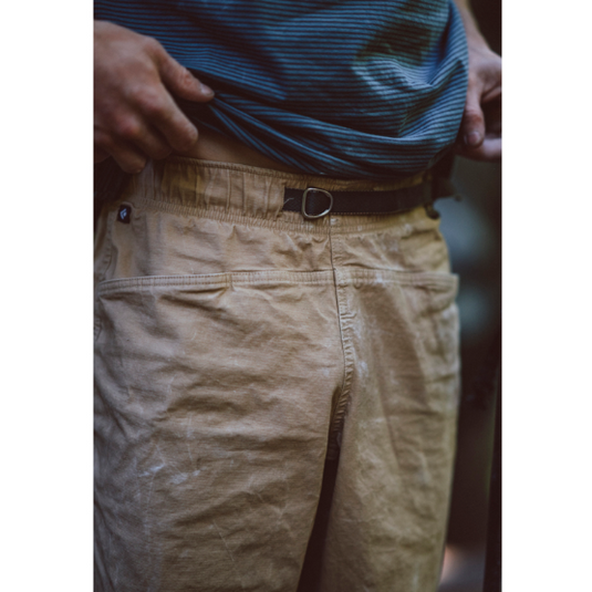 Black Diamond Ethos Pants in Khaki - Worn by climber. Close up of waist. chalky imprints on pants