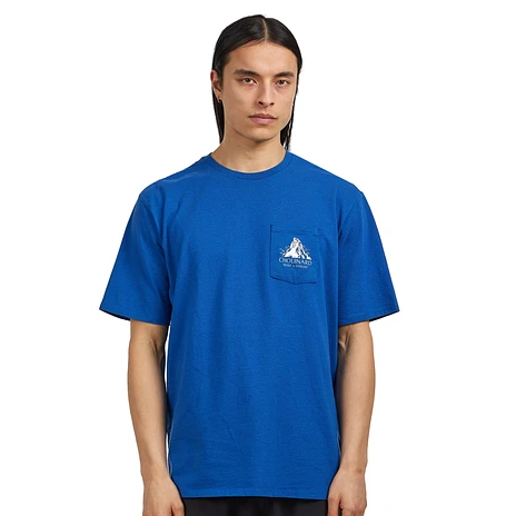 Patagonia Mens Chouinard Crest Pocket Responsibili-Tee® In Endless Blue with small mountain design on pocket worn by model