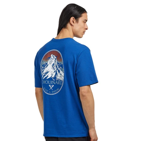 Patagonia Mens Chouinard Crest Pocket Responsibili-Tee® In Endless Blue with large mountain design on pocket worn by model facing away