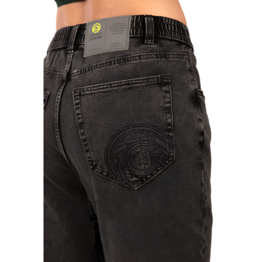 3rd rock gaia jeans in ink black worn by model facing away with embroided detail on back pocket