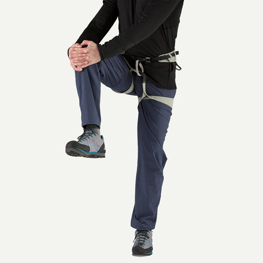Patagonia Mens Venga Rock Pants in smoulder blue worn by model in harness