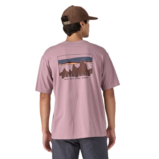 Patagonia Mens '73 Skyline Organic T-Shirt in Stormy Muave with large patagonia logo on back worn by model facing away with save our home planet text