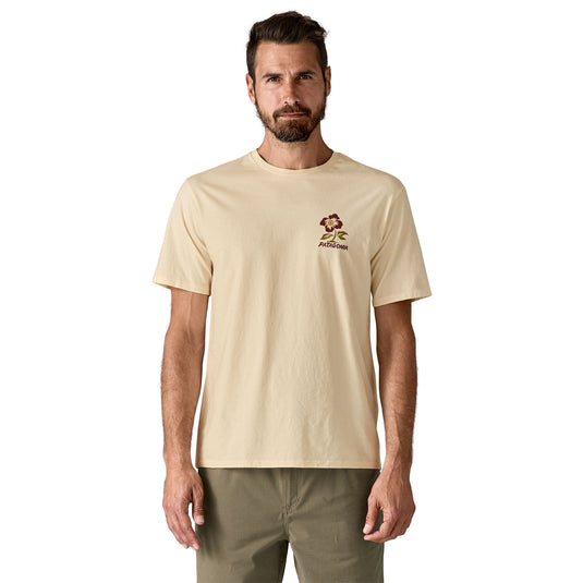 Patagonia Mens Balance Organic T-Shirt in Peace-seed undyed natural worn by model with flower graphic on chest