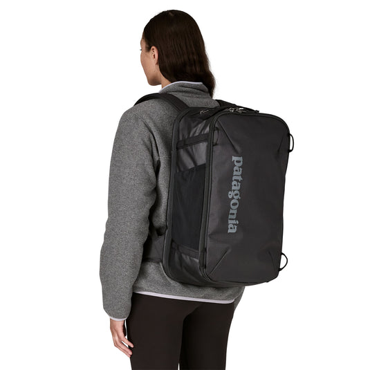 Patagonia Black Hole Mini MLC - 30L in Black worn on back of model