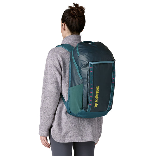 Patagonia Black Hole Pack 32L in Teal on models back