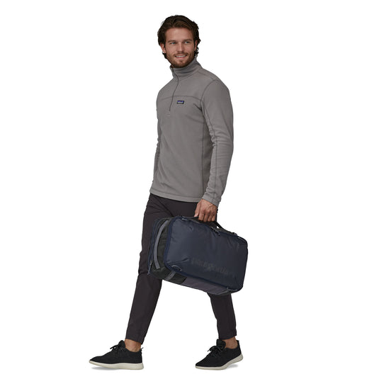 Patagonia Black Hole Mini MLC i carried by model in duffel mode